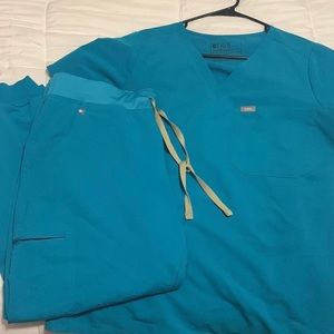 Figs Teal Catarina/Zamora. Used but in good condition.